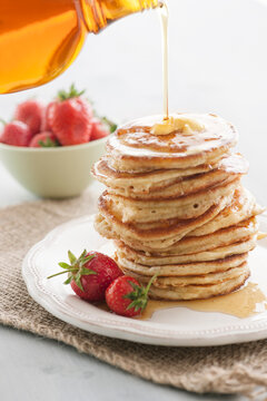 Food: Wholemeal Pancakes with melted butter, maple syrup and str