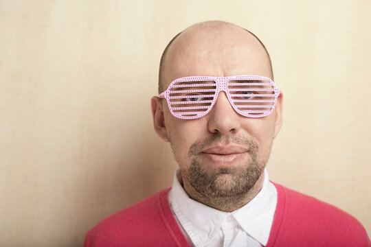 nerd with pink party glasses