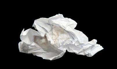 A piece of crumpled white paper on a black background.