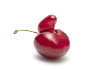Ripe sweet cherry isolated on a white background, closeup.