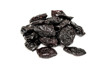 Dried prunes isolated on a white background.