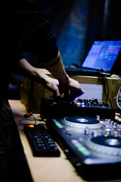 Male Hardcore DJ at a rave party