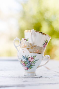 stacked vintage china rose patterned teacups