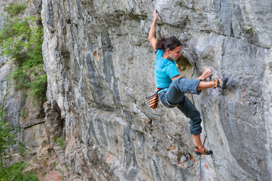 Young woman rock climbing outdoor