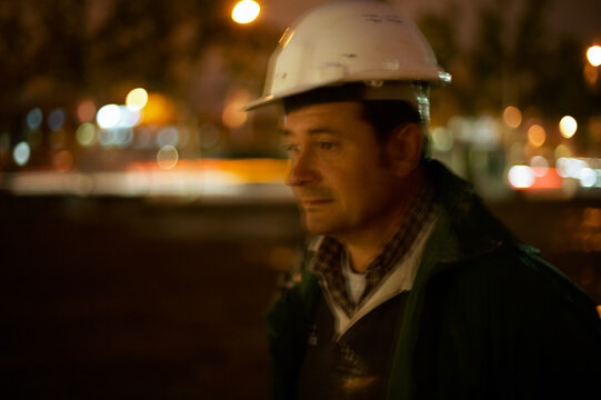 Long exposure portrait of a construction worker at night