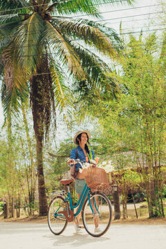 Happy Woman Pusing Her Bicycle