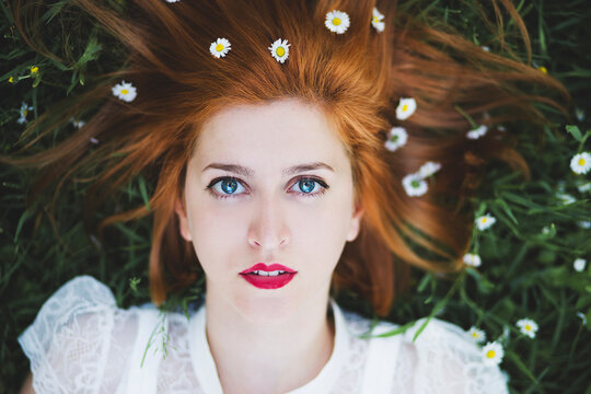 Beautiful ginger haired woman with blue eyes