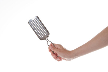 hand holding cheese grinder vertically.