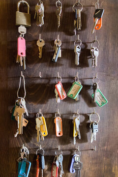 Dozens of keys on wooden board