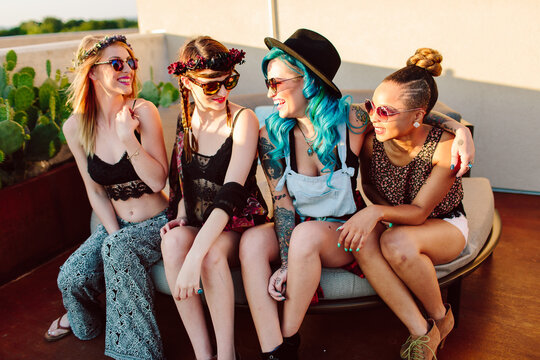 A group of girl friends hanging out outdoors
