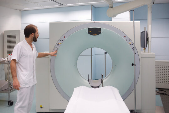 CT scan and technician preparing turning on the equipment
