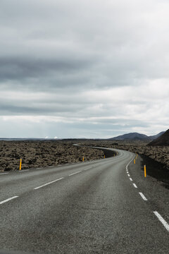 Icelandic road through moss covered lava fields