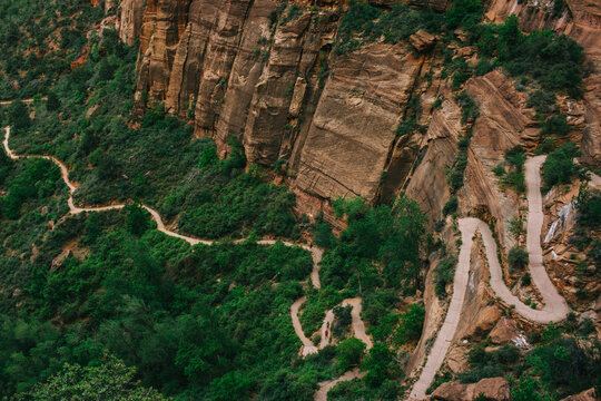 path zig zags down mountain side in national park wilderness