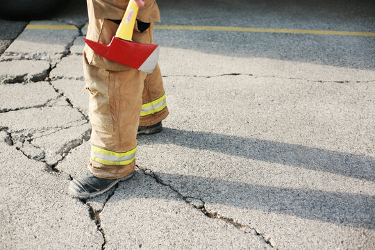 Firefighter holding axe