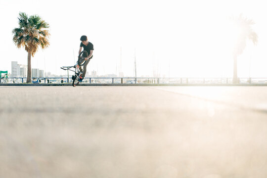 Skilled BMX rider on summer day