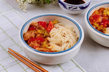 Boiled rice noodles with broccoli, chicken and bell pepper in sweet and spisy sauce.