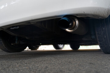 Under view of car suspension and close up automobile exhaust pipes are beautiful from the blue color. For car decorators.