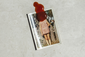 blody mary ,hiding something behind her back, with a red stain of ketchup over her face