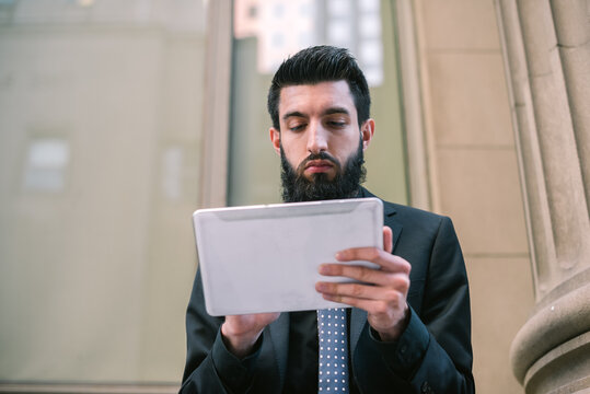 Young Hip Businessman Using Tablet Computer