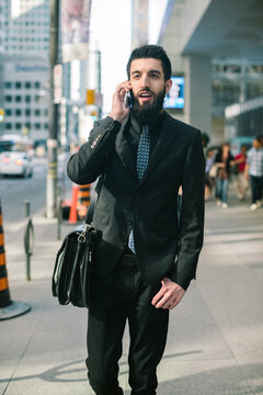 Young Hip Businessman in Suit on Phone