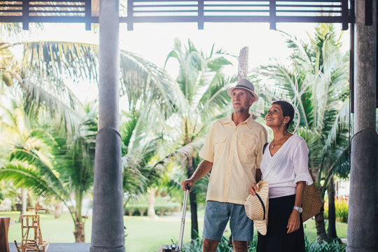 Senior Couple Arrives at a Tropical Resort