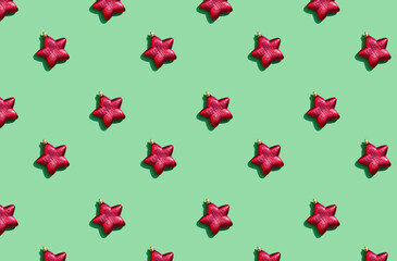 Minimal pattern background of red star on green background