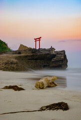 Japanese shrine at sunset on the beach