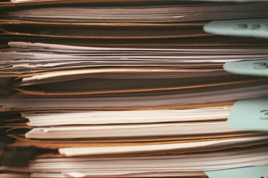 Stack of documents folders on office. Selective focus.
