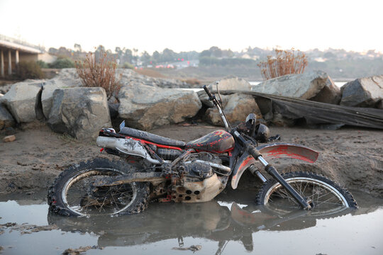 Motorcycle Laying In A mud Puddle