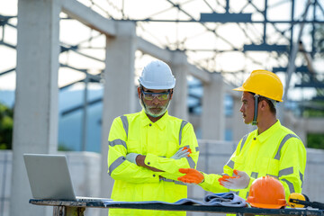 Construction worker discussing project details at building site.
