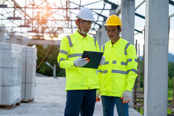 Construction worker discussing project details at building site.