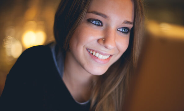 Happy young girl with tablet
