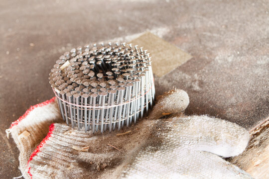 Brad nails and glove for carpentry woodwork
