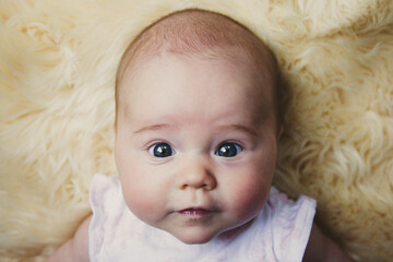 Serious portrait of baby girl at 2 months old