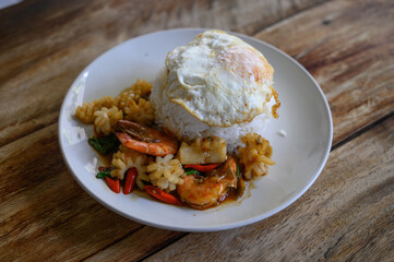 Stir Fried Seafood with Chili Paste and fried egg Thai food
