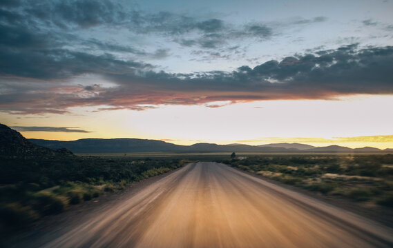 Sunset whilst travelling on a dirt road through the karoo