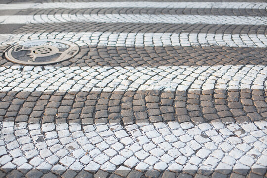 Zebra crossing on paving stone.