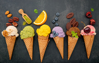 Various of ice cream flavor in cones blueberry ,green tea ,pistachio ,almond ,orange and cherry...
