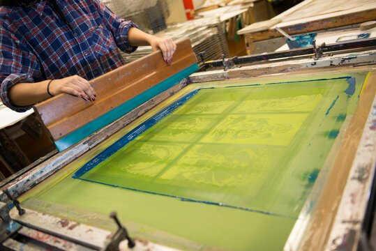 Traditional Printing Studio. Person making a screen print.