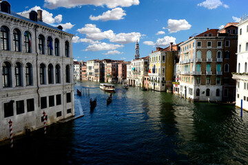 grand canal in Venice with blue sky and white clouds