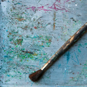 Paintbrush on a colorful background