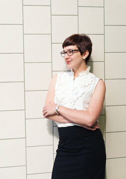 woman against tiled wall