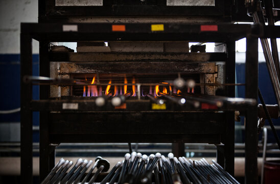 Glass: Blowpipes In Pipe Warmer Waiting To Be Used For Glass Blo