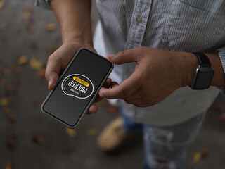 Cropped shot of male using mock up smartphone