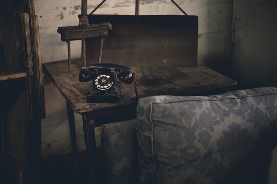 Antique room with old phone and wood furniture