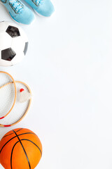 Sport games background - basketball, soccer ball, rackets, sneakers. Copy space