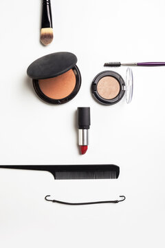 Makeup face. A face shape with different makeup tools.