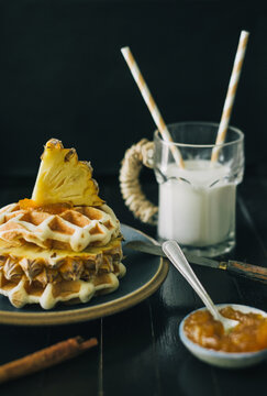 Typical breakfast table with milk and waffle