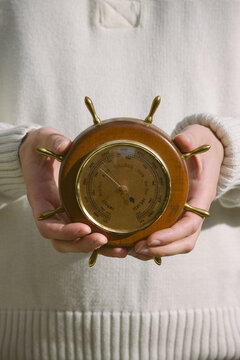 Holding a barometer