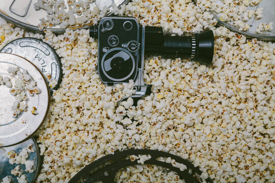 Cinema cameras, reels and popcorn.
